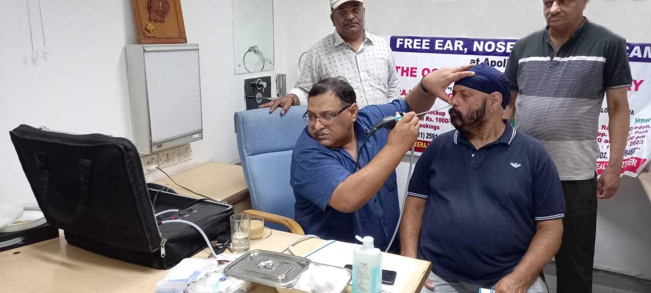 Dr Rajeev Nangia checking the patient